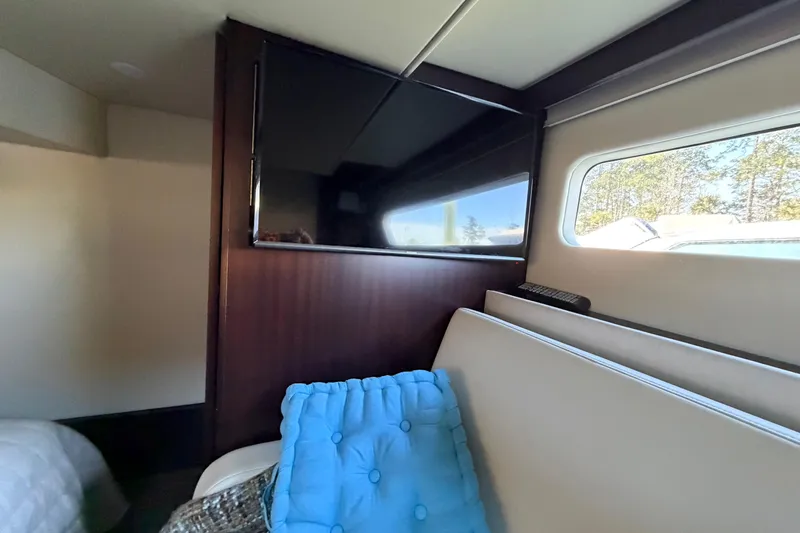 Dancing Queen Yacht Photos Pics Interior of 2019 Regal 42 Grande Coupe with TV and window view.