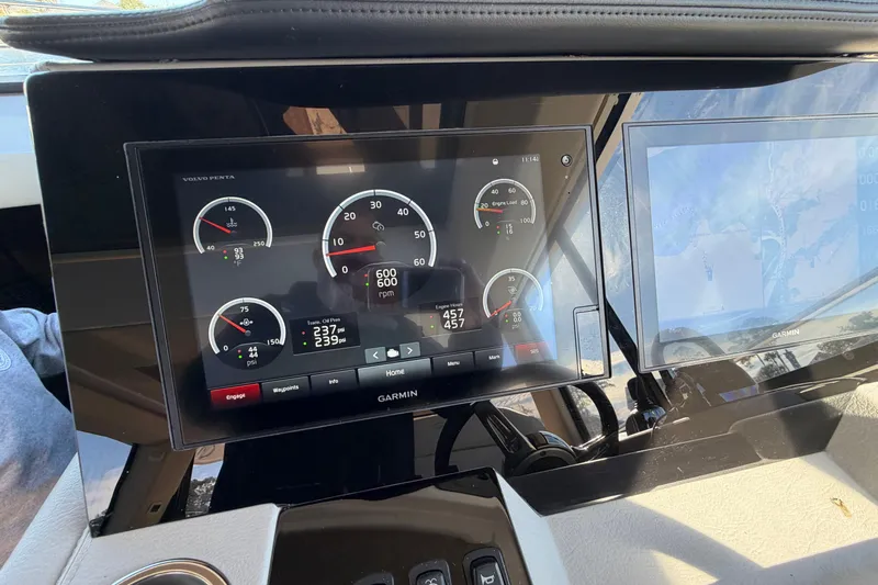 Dancing Queen Yacht Photos Pics Dashboard of 2019 Regal 42 Grande Coupe with Garmin display and engine gauges.