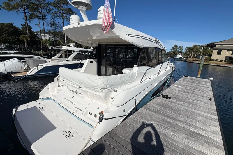 Dancing Queen Yacht Photos Pics 2019 Regal 42 Grande Coupe yacht docked on a sunny day.