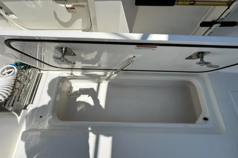 Blue Liner Yacht Photos Pics Open storage compartment on 2021 Pursuit S 428 Sport boat.