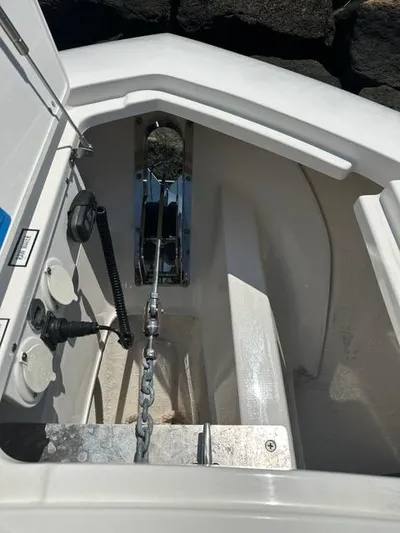 Blue Liner Yacht Photos Pics 2021 Pursuit S 428 Sport anchor compartment with chain and controls.