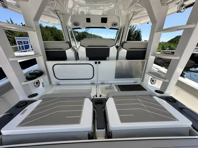 Blue Liner Yacht Photos Pics Interior of 2021 Pursuit S 428 Sport boat with seating and storage compartments.