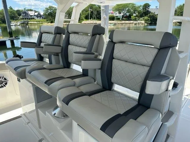 Blue Liner Yacht Photos Pics Luxurious seating on 2021 Pursuit S 428 Sport boat, featuring quilted upholstery.