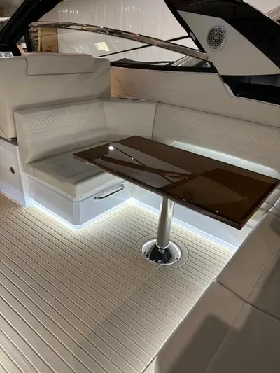  Yacht Photos Pics Luxurious 2024 Cruisers Yachts 42 GLS interior with elegant seating and sleek table design.