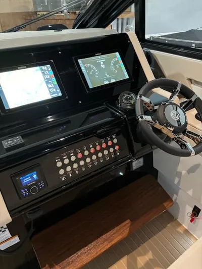 Yacht Photos Pics 2024 Cruisers Yachts 42 GLS helm with dual displays and modern controls.
