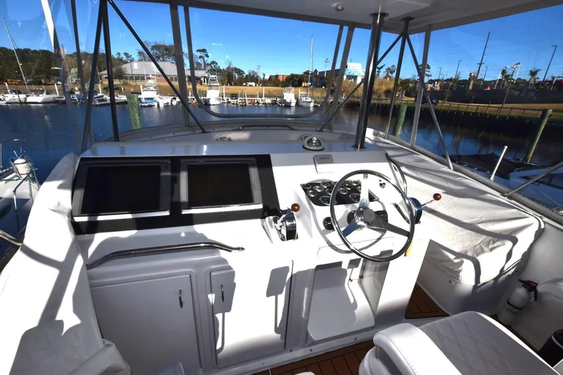 The Dog Patch Yacht Photos Pics Helm of 1990 Ocean Yachts 48 Super Sport with dual screens and steering wheel.