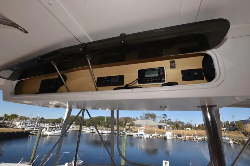 The Dog Patch Yacht Photos Pics 1990 Ocean Yachts 48 Super Sport electronics panel with marina view in background.