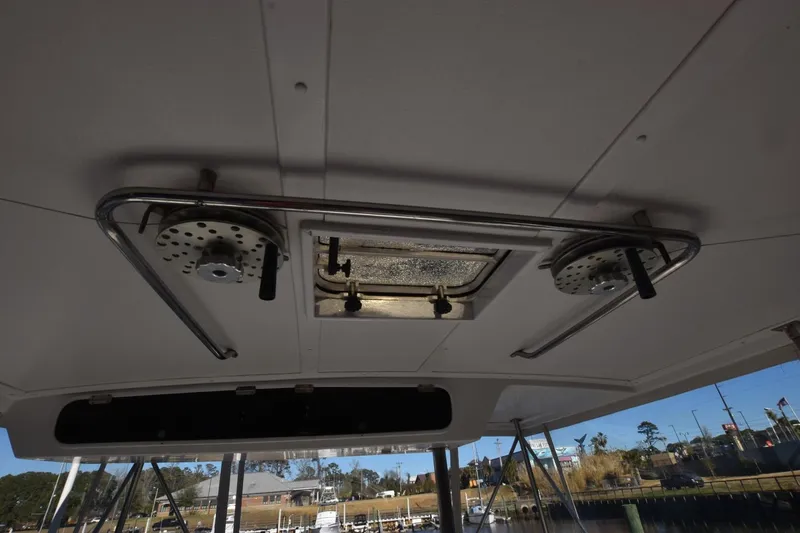 The Dog Patch Yacht Photos Pics Ceiling view of 1990 Ocean Yachts 48 Super Sport with metal fixtures and hatch.