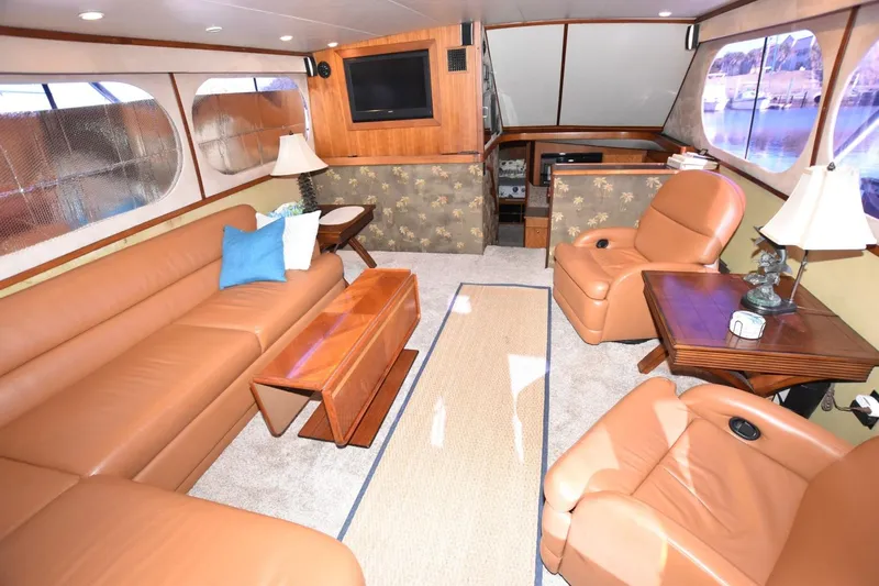 The Dog Patch Yacht Photos Pics Luxurious interior of 1990 Ocean Yachts 48 Super Sport with leather seating and elegant decor.