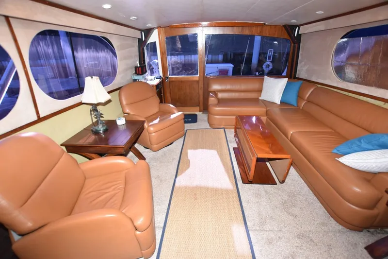 The Dog Patch Yacht Photos Pics Luxurious interior of a 1990 Ocean Yachts 48 Super Sport with leather seating and elegant decor.