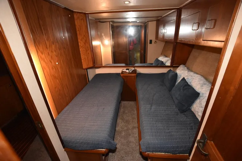 The Dog Patch Yacht Photos Pics 1990 Ocean Yachts 48 Super Sport cabin with twin beds and wooden interior.