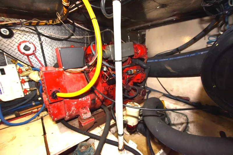 The Dog Patch Yacht Photos Pics Engine room of 1990 Ocean Yachts 48 Super Sport with red machinery and wiring.