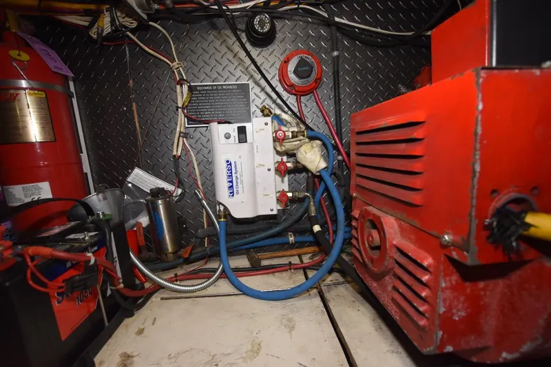 The Dog Patch Yacht Photos Pics Engine room of 1990 Ocean Yachts 48 Super Sport with mechanical components and wiring.