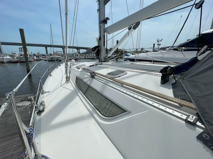 Sea Bear Yacht Photos Pics Jeanneau Sun Odyssey 45.2 sailboat docked, showcasing sleek deck design, 1998 model.