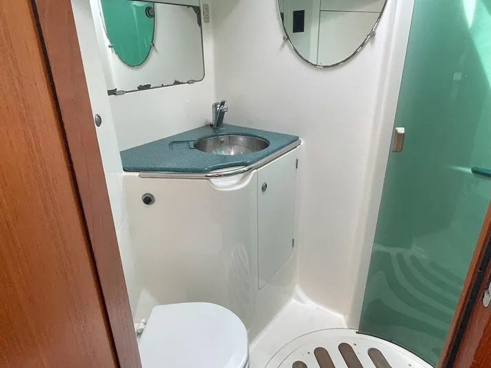 Sea Bear Yacht Photos Pics Bathroom interior of 1998 Jeanneau Sun Odyssey 45.2 yacht, featuring sink and toilet.