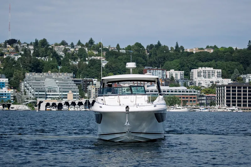  Yacht Photos Pics 2019 Sea Ray Sundancer 320 yacht on water with cityscape background.