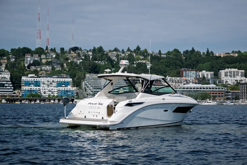  Yacht Photos Pics 2019 Sea Ray Sundancer 320 yacht cruising near Seattle waterfront.