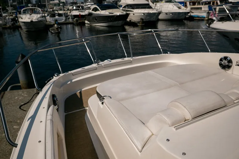  Yacht Photos Pics 2019 Sea Ray Sundancer 320 yacht docked at marina, featuring spacious sunbathing area.