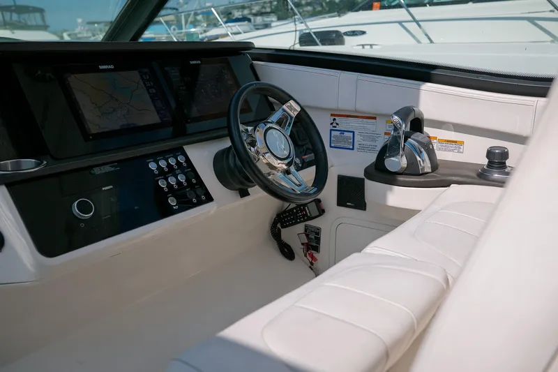  Yacht Photos Pics 2019 Sea Ray Sundancer 320 helm with modern controls and navigation displays.
