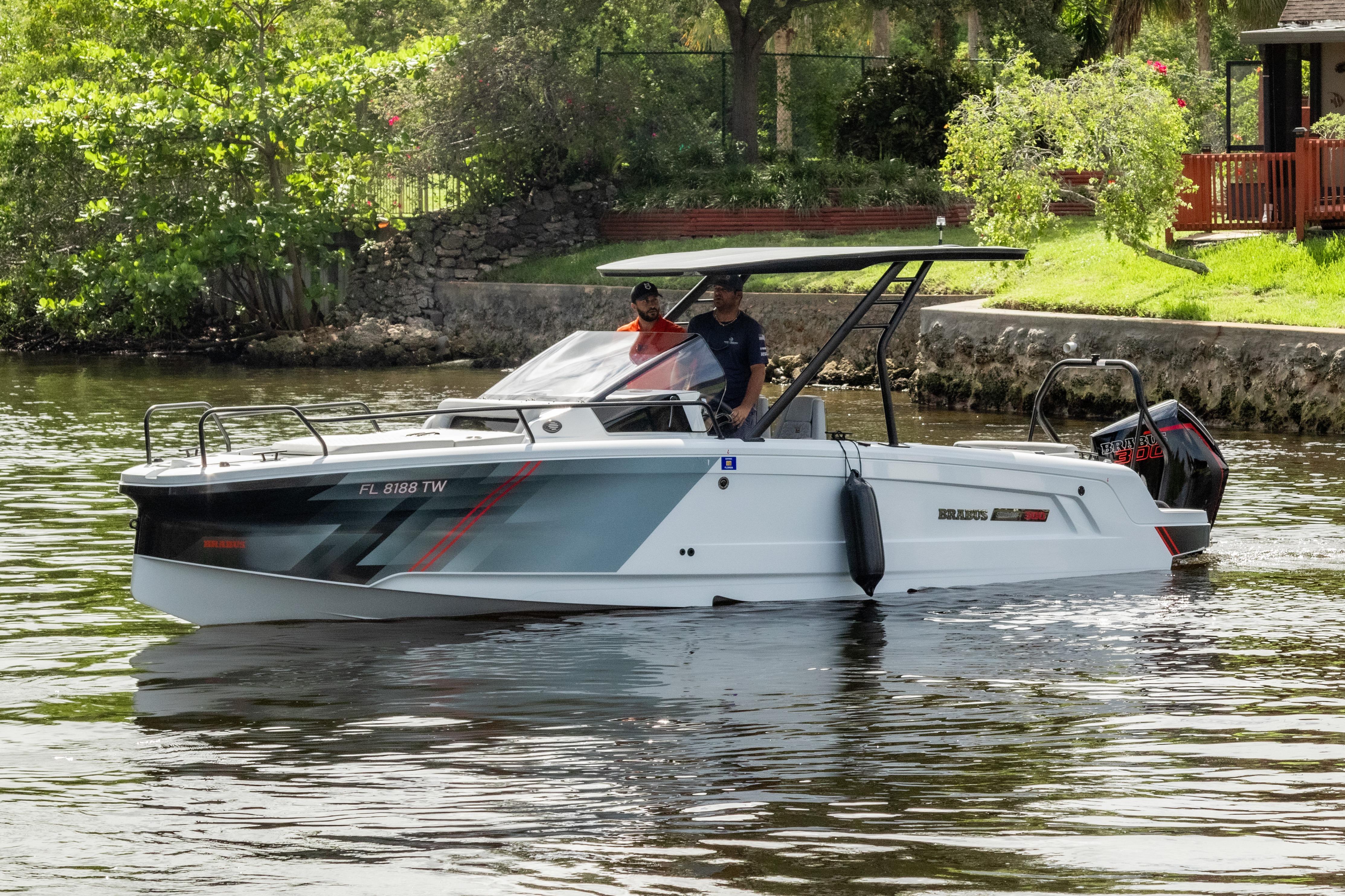 2023 BRABUS Shadow 300 XT boat cruising on a scenic waterway.