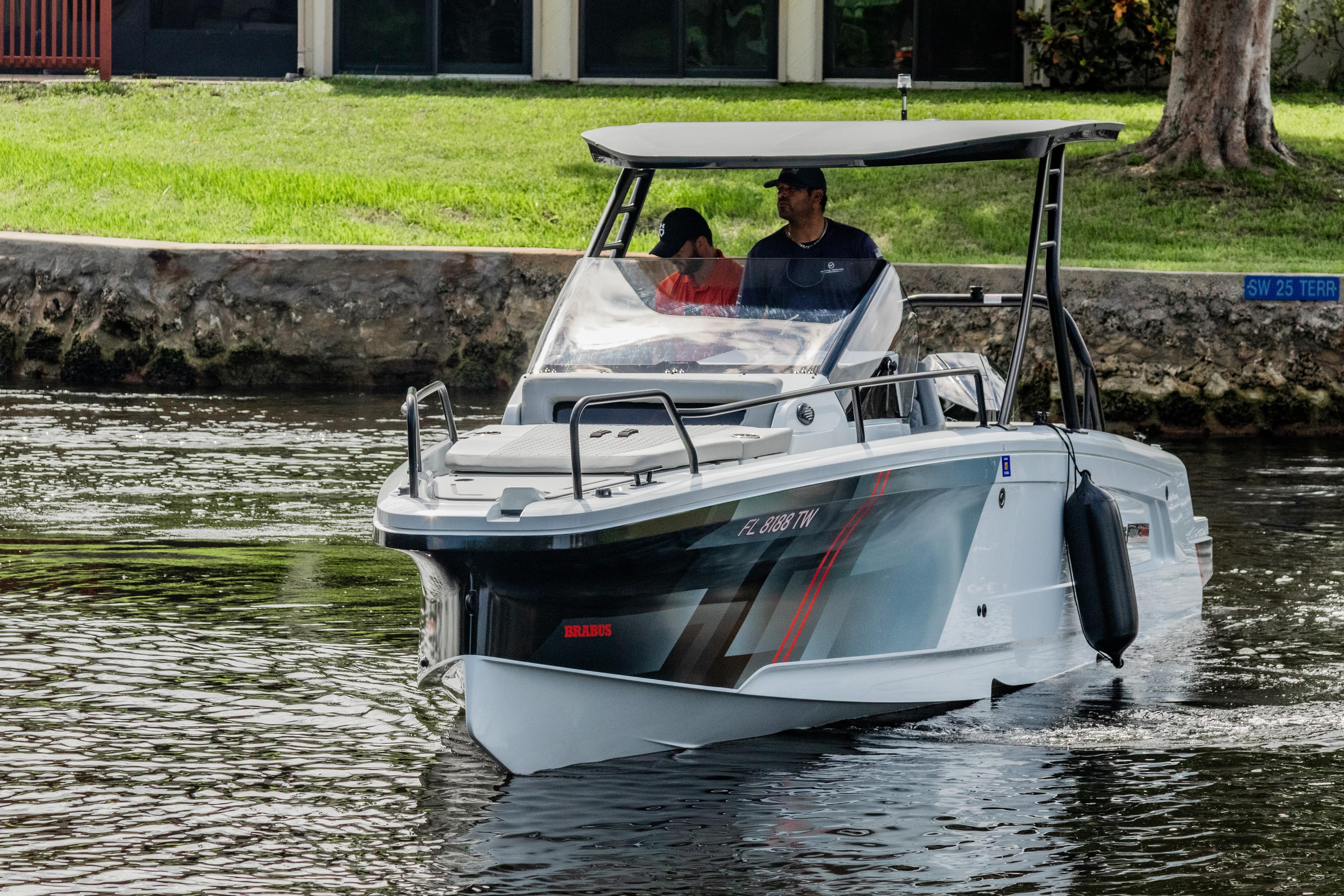 2023 BRABUS Shadow 300 XT boat cruising on a calm waterway.