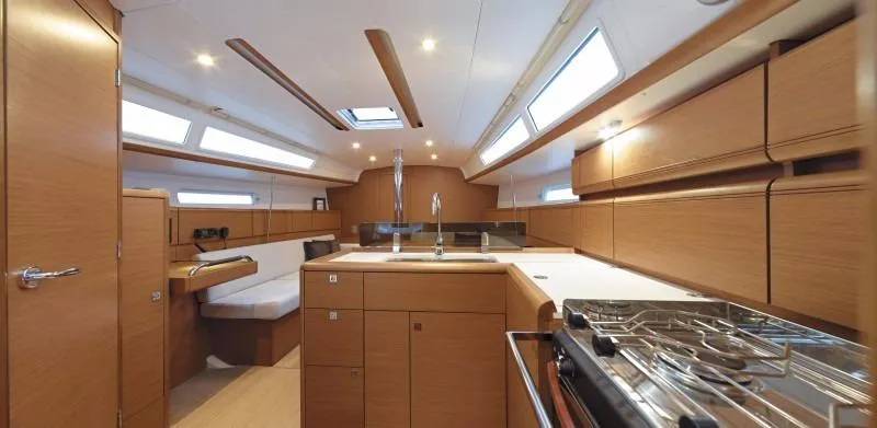 Statira Yacht Photos Pics Manufacturer Provided Image: Interior of 2017 Jeanneau Sun Odyssey 389 sailboat with modern kitchen and seating area.