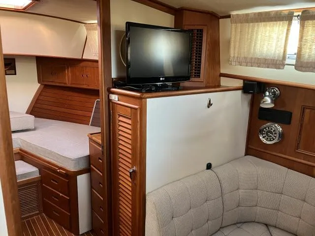 Lio Kai Yacht Photos Pics Interior of 1999 Grand Banks Eastbay 38 yacht with cozy seating and TV.