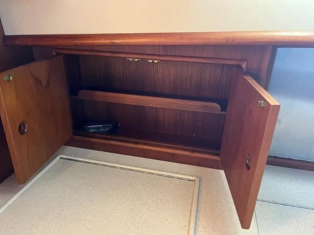 Lio Kai Yacht Photos Pics Open wooden cabinet inside 1999 Grand Banks Eastbay 38 yacht.