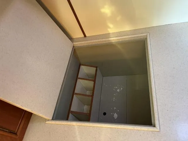 Lio Kai Yacht Photos Pics Storage compartment on 1999 Grand Banks Eastbay 38 yacht, featuring built-in shelves.