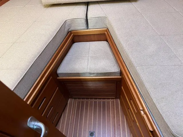 Lio Kai Yacht Photos Pics Interior cabin of 1999 Grand Banks Eastbay 38 with cushioned seating.