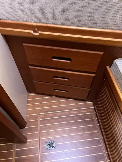 Lio Kai Yacht Photos Pics Wooden interior drawers on 1999 Grand Banks Eastbay 38 yacht with striped flooring.