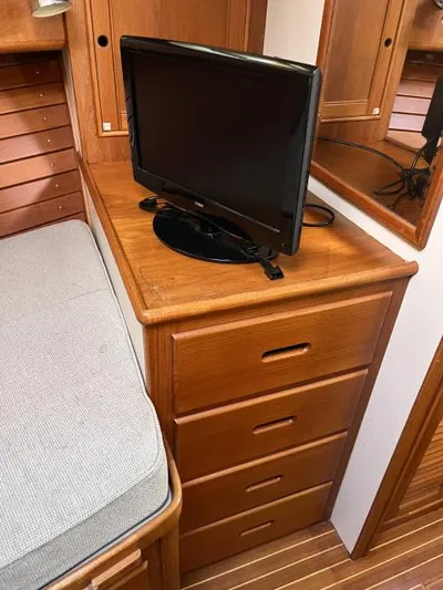 Lio Kai Yacht Photos Pics Wooden interior of 1999 Grand Banks Eastbay 38 with TV and drawers.