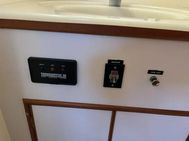 Lio Kai Yacht Photos Pics Control panel on a 1999 Grand Banks Eastbay 38 yacht interior.