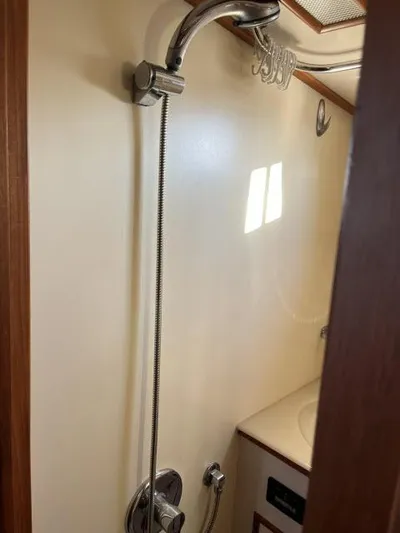 Lio Kai Yacht Photos Pics Shower area in 1999 Grand Banks Eastbay 38 yacht bathroom.