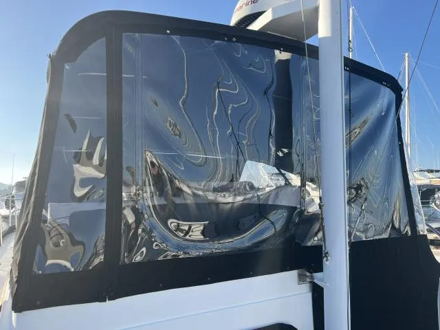 Lio Kai Yacht Photos Pics 1999 Grand Banks Eastbay 38 with clear enclosure panels in a marina setting.