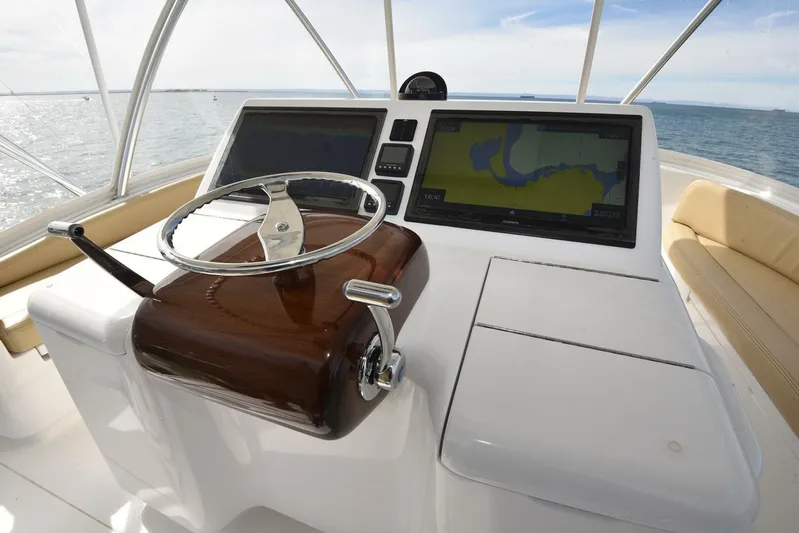My Way Yacht Photos Pics 2019 Viking 44 Convertible yacht helm with navigation screens and steering wheel.
