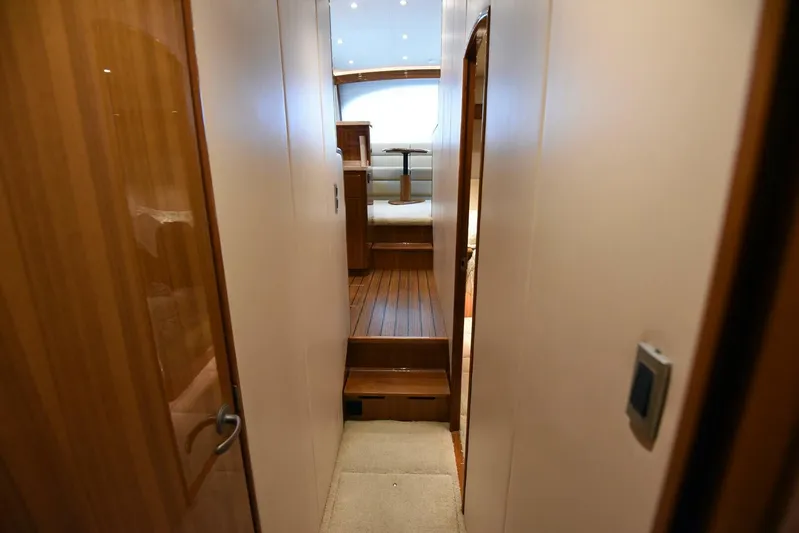 My Way Yacht Photos Pics Interior hallway of 2019 Viking 44 Convertible yacht with wooden flooring.