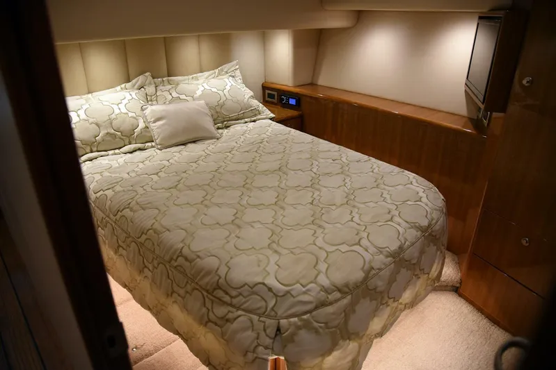 My Way Yacht Photos Pics Luxurious bedroom interior of 2019 Viking 44 Convertible yacht with elegant bedding.