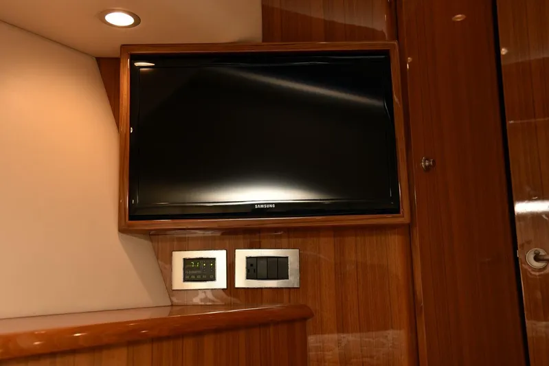 My Way Yacht Photos Pics 2019 Viking 44 Convertible interior with mounted TV and control panel.