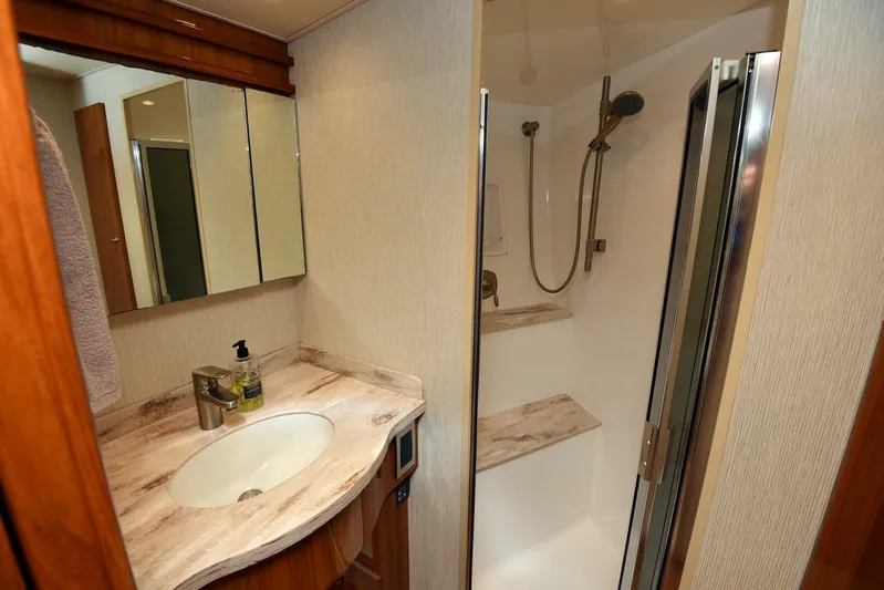 My Way Yacht Photos Pics Luxurious bathroom in 2019 Viking 44 Convertible yacht with modern fixtures and shower.