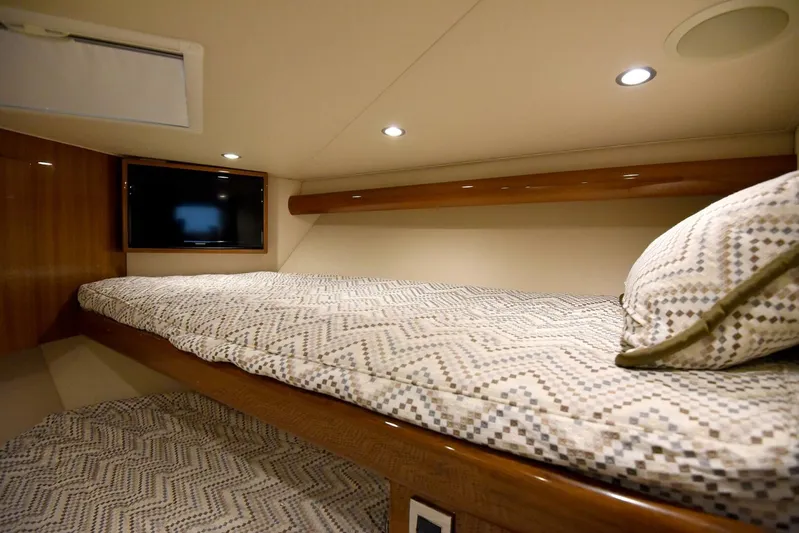 My Way Yacht Photos Pics Luxurious cabin interior of 2019 Viking 44 Convertible yacht with cozy bedding.
