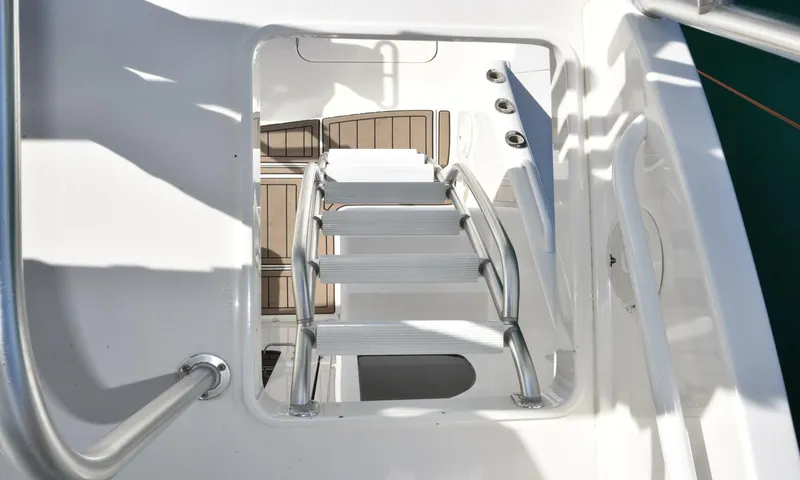 My Way Yacht Photos Pics Staircase on 2019 Viking 44 Convertible yacht, featuring sleek white design and metal railings.