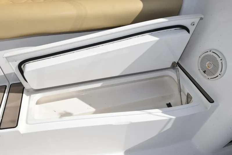 My Way Yacht Photos Pics Open storage compartment on 2019 Viking 44 Convertible boat with beige seating.