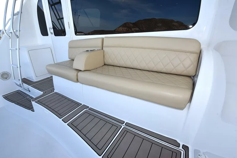 My Way Yacht Photos Pics Luxurious seating on 2019 Viking 44 Convertible yacht with beige cushions and sleek design.