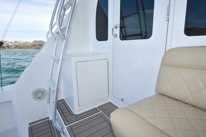 My Way Yacht Photos Pics 2019 Viking 44 Convertible yacht interior with beige seating and ocean view.