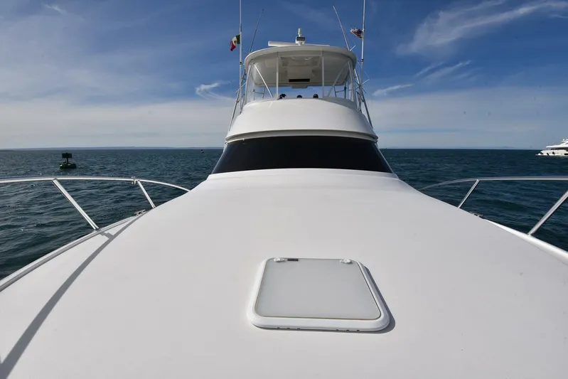 My Way Yacht Photos Pics 2019 Viking 44 Convertible yacht on open sea, clear sky background.