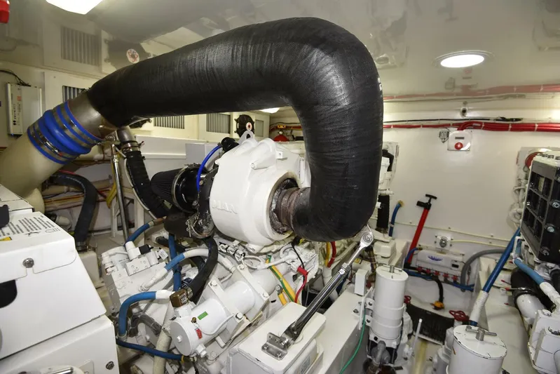 My Way Yacht Photos Pics Engine room of 2019 Viking 44 Convertible yacht, showcasing complex machinery and piping.