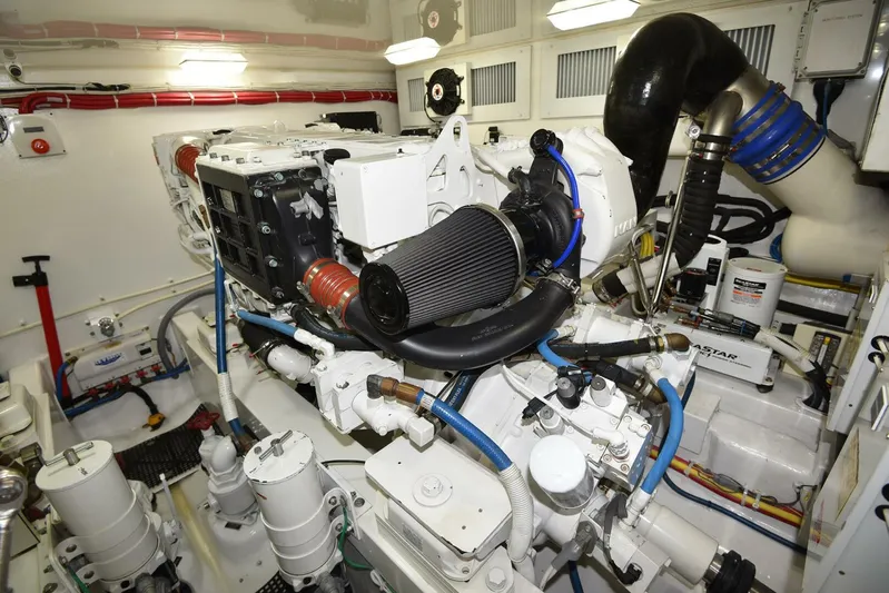 My Way Yacht Photos Pics Engine room of 2019 Viking 44 Convertible yacht, showcasing complex machinery and components.