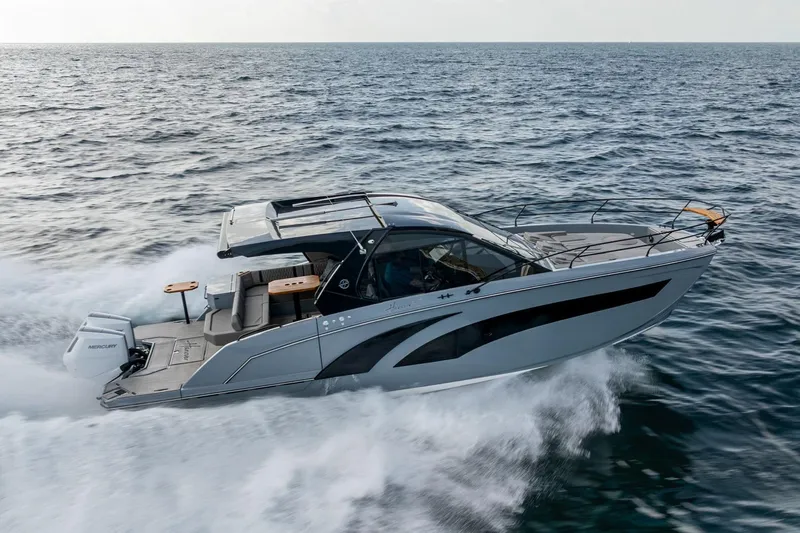  Yacht Photos Pics 2025 Hanover 387 boat cruising on open water, showcasing sleek design and powerful performance.