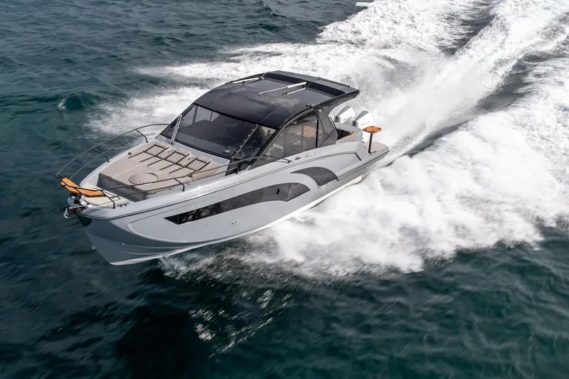  Yacht Photos Pics 2025 Hanover 387 yacht cruising swiftly on open water.